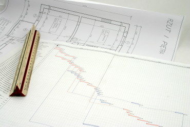 Double Diamond Project Management, project plans on desk